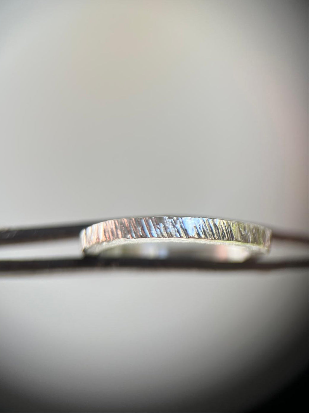 Silver ring on a blurred background