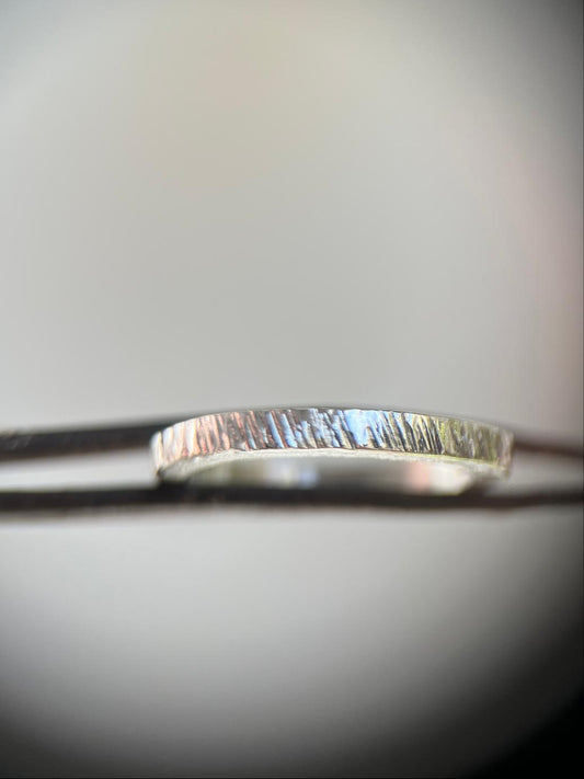 Silver ring on a blurred background